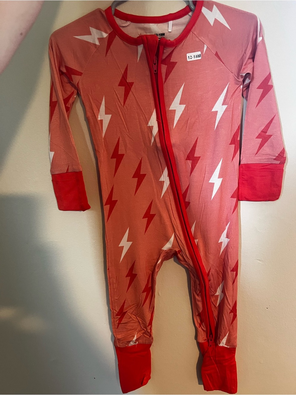 Coral Lightning Bolt Kids' Footed One-Piece with Red Trim